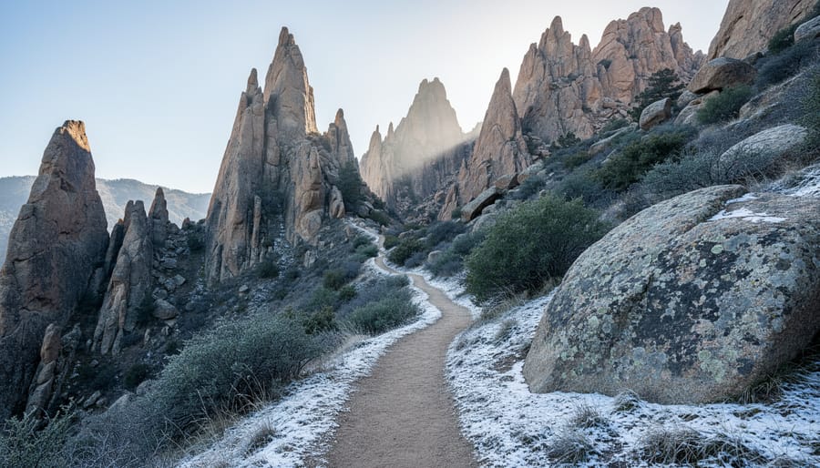 Winter hikers on a rocky trail through volcanic formations at Pinnacles National Park